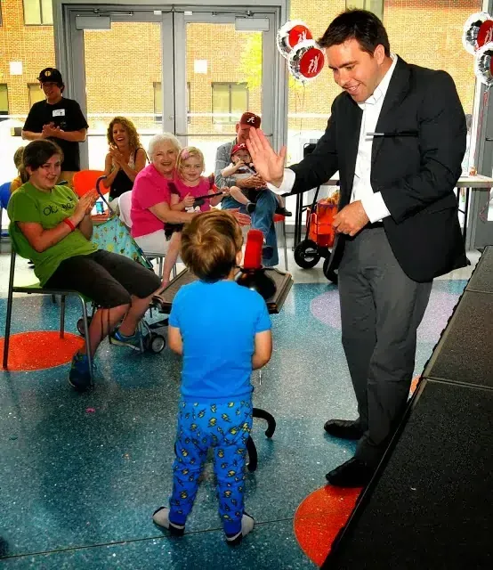 A boy successfully performing a trick during the Children's Hospital show.